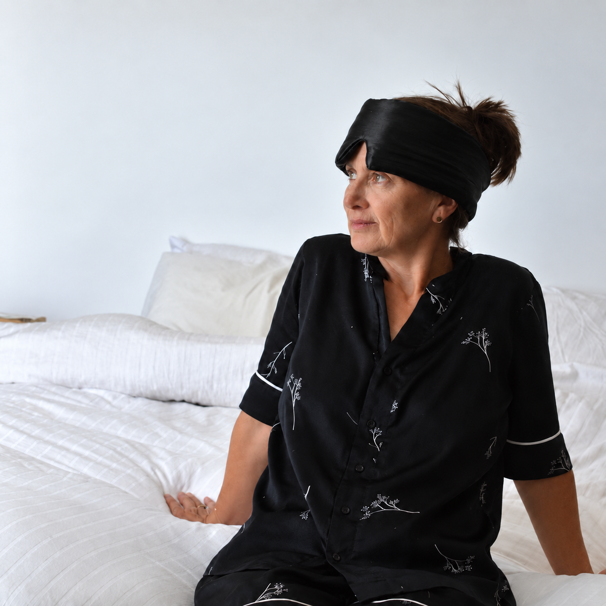 Organic Mulberry Silk Sleep Mask in Midnight Black, Person