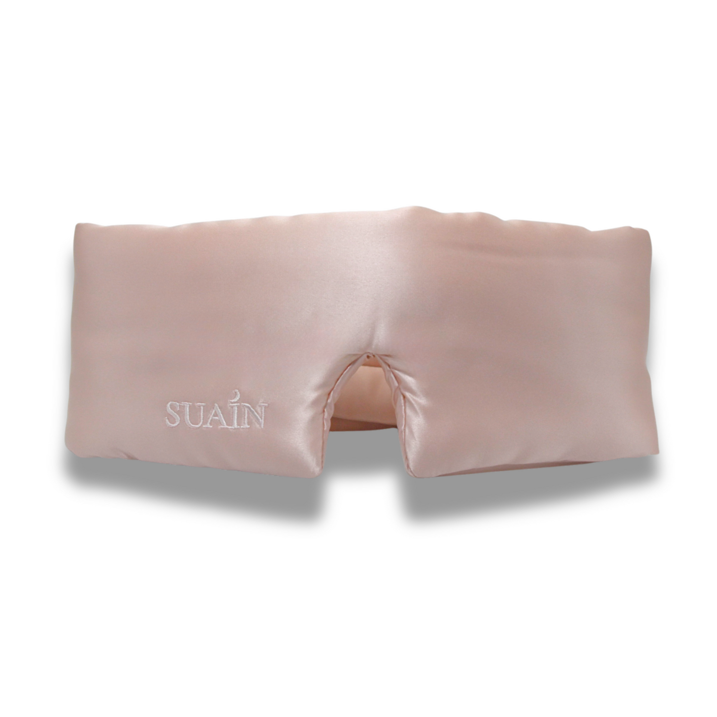 Pink eye mask with 'SUAN' branding on a white background