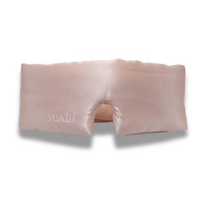 Pink eye mask with 'SUAN' branding on a white background