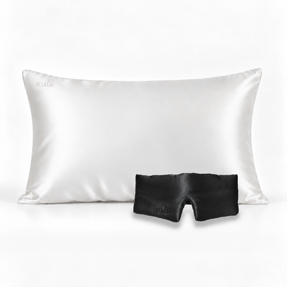 Ivory White silk pillowcase with a Midnight Black silk sleep mask
