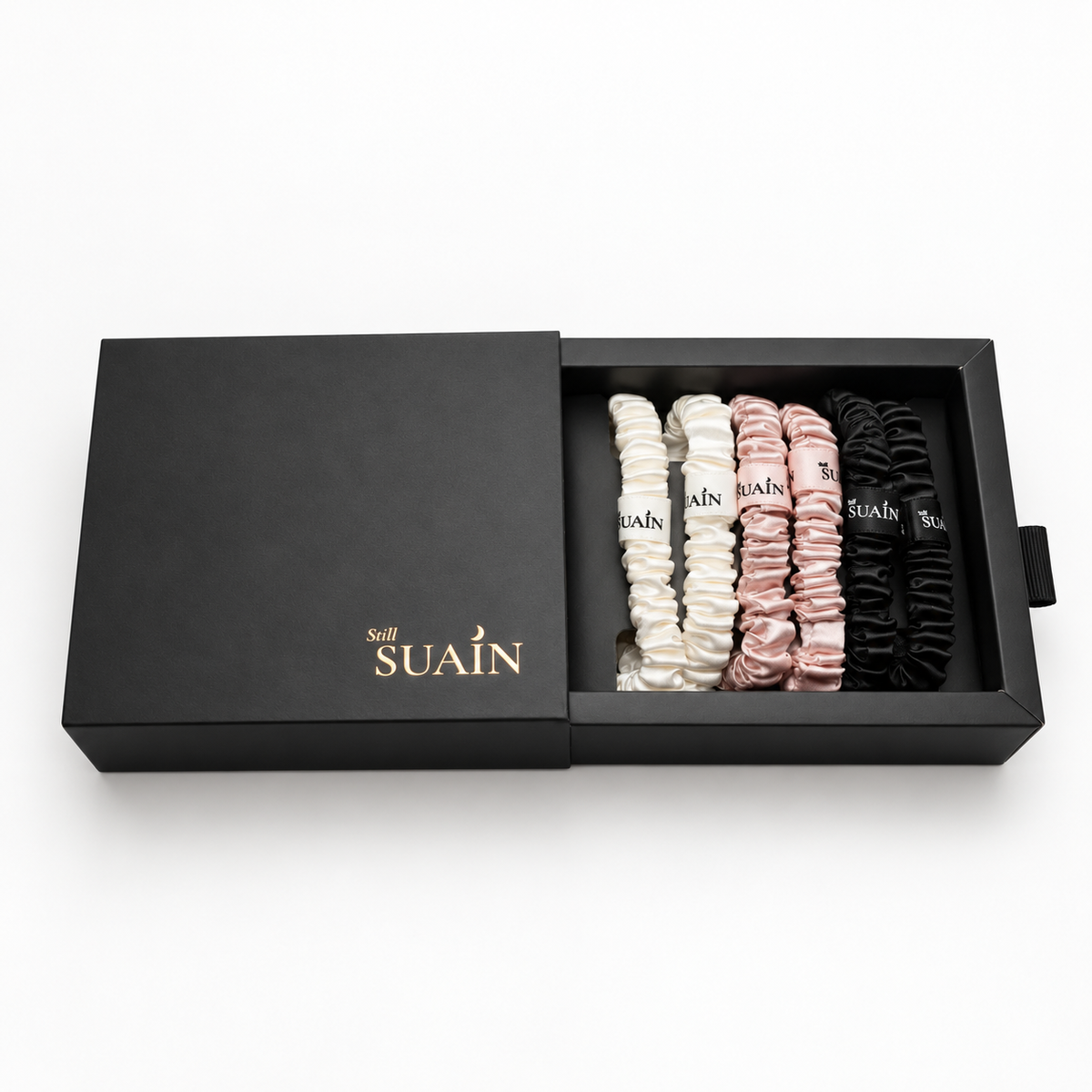 Six silk skinny scrunchies in a Still Suain gift box, image 1